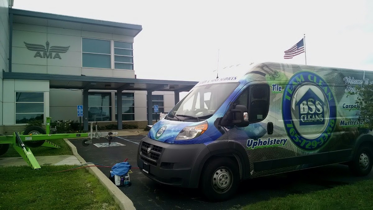 The wrapped BSS Cleans van parked outside a Muncie building